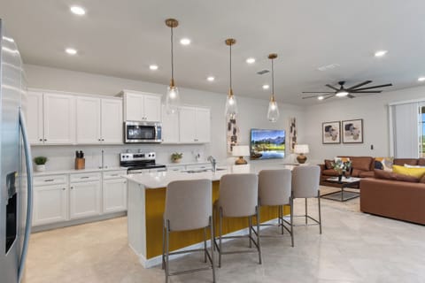 Expansive Full Size Kitchen with Bar Stool Seating