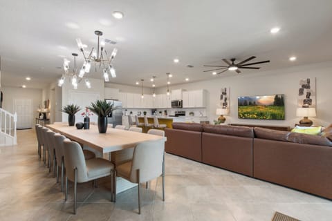 Gorgeous Downstairs Area with Dining Table, Full Kitchen Flat Screen TV and Comfortable Lounge