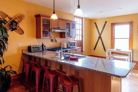 The kitchen has a large breakfast bar for enjoying morning coffee and planning your day in Burlington