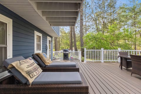 Relax in the chaise lounge chairs on the back deck, a perfect retreat for rest and relaxation.