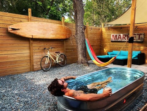 Cool down in the Stock tank pool after a nice walk downtown!