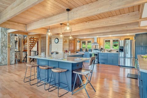 Large open kitchen and bar area between the dining room and living room