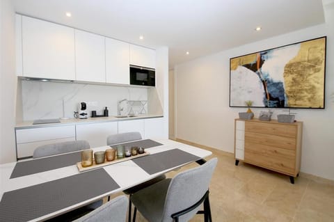 More pictures of the dining area for four guests next to the kitchen