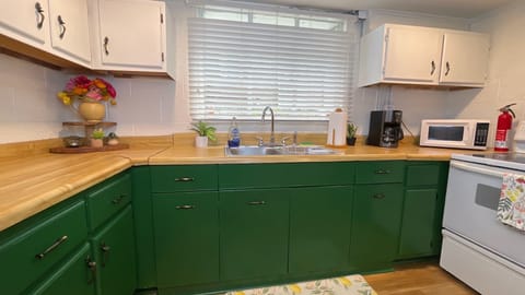 You’ll love this clean, well-stocked kitchen—perfect for cooking or quick bites!