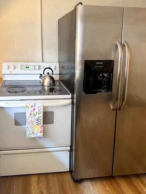 Cook up comfort with a handy stove and spacious refrigerator at your fingertips. Everything you need is right here to whip up meals with ease.