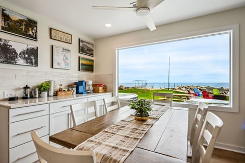 Dining area with custom farmhouse table overlooking the lake