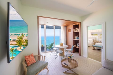 Living area. Unit with 2 Queen beds. Exact unit will be assigned upon arrival. Views, colors, and decor may vary.