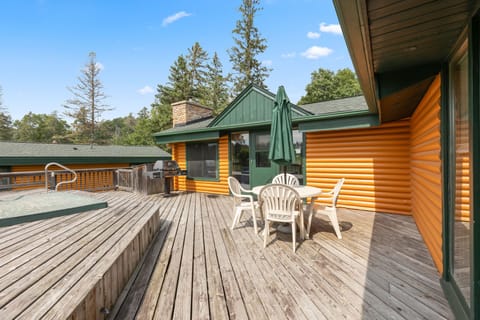 Step out onto the spacious deck where you can enjoy a meal in the fresh air or relax by the hot tub, surrounded by nature's beauty.