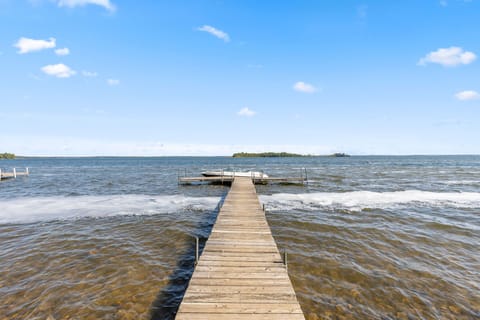 A peaceful dock view stretching out over the sparkling lake.