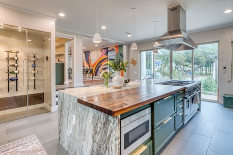 Kitchen view with wood countertops and natural light. (Main house)