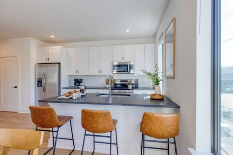 Designed for convenience with a full-size fridge, stove, and microwave.