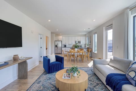 Open layout connecting seamlessly to the dining and kitchen areas.