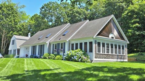 Bright and spacious home with lovely landscaping and interior spaces