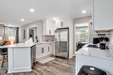 Stylish Kitchen with partial view of Living Room