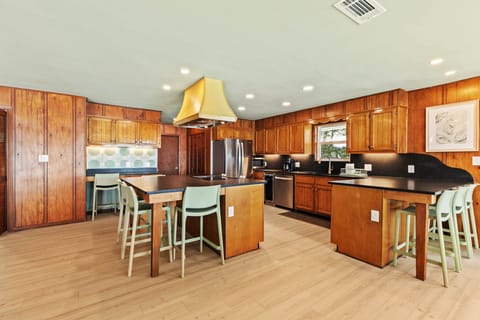 Fully equipped kitchen with bar seating for 8.