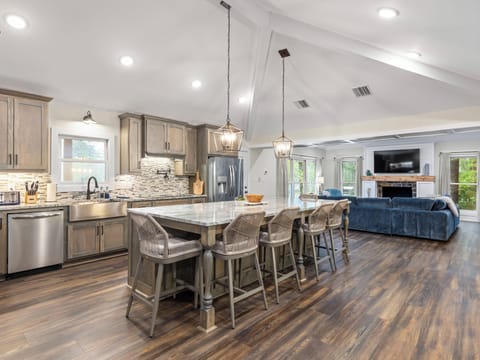 The kitchen and great room make for the perfect gathering area for large groups. The kitchen is fully equipped and has 2 ovens to accomodate cooking for lots of folks
