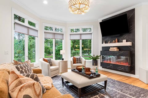 Our living room features a 65` TV and an electric fireplace.  The perfect spot to watch TV as a family.