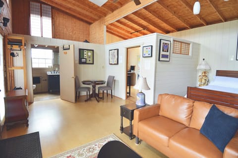 Livingroom looking towards bathroom and separate kitchen