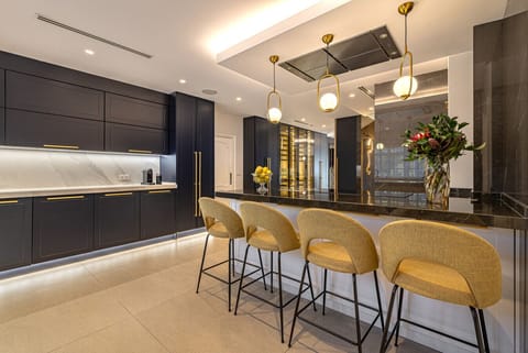 Spacious double kitchen designed for private chefs and seamless event hosting