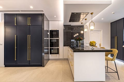 Spacious double kitchen designed for private chefs and seamless event hosting