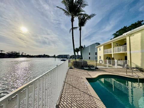 Whether you're diving in for a refreshing swim, relaxing poolside on one of the lounge chairs, or enjoying the warmth of the sun as you read a book, this space is designed for ultimate relaxation. 