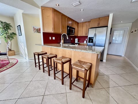 This kitchen is perfect for cooking a hearty breakfast before a beach day or preparing a simple dinner to enjoy with loved ones