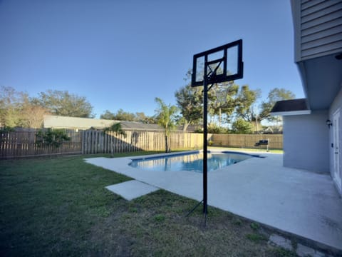 Whether you're shooting hoops or cooling off in the pool, this space is designed for both play and relaxation.