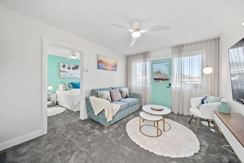Cosy, sunlit living space with comfy seating—ideal for relaxing
