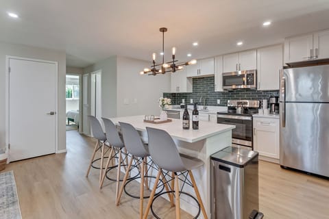 Full kitchen with stainless steel appliances. 