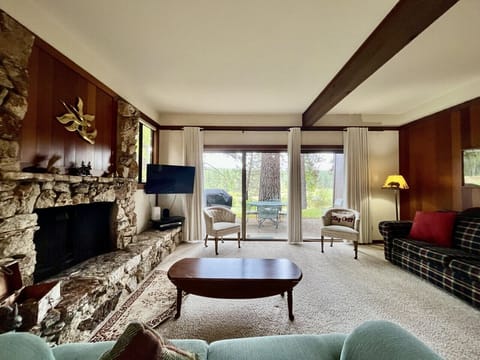 Snuggle up by the native rock fireplace while enjoying the views