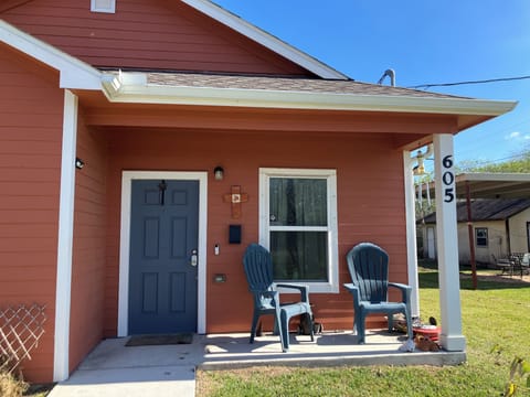 Exterior front porch showing wheelchair friendly walkway from parking pad