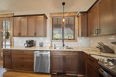 Stainless Appliances and Basin Sink in the Kitchen
