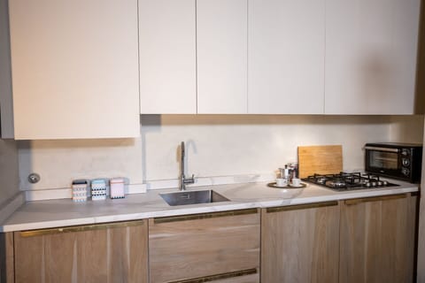 Kitchen, Countertop, Wood, Kitchen Appliance, Interior Design, Cabinetry, Flooring, Major Appliance, Kitchen Sink, Home Appliance