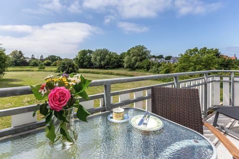 Balcony with Table and Flowers