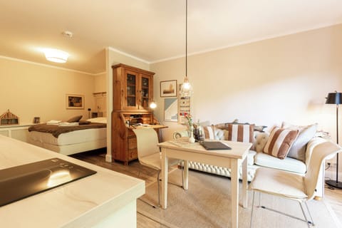 Bright Living Room with Sofa and Dining Table