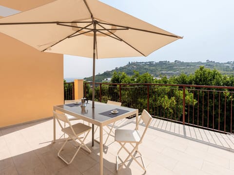 Furniture, Chair, Outdoor Furniture, Table, Outdoor Table, Kitchen & Dining Room Table, Umbrella, Shade, Restaurant, Patio