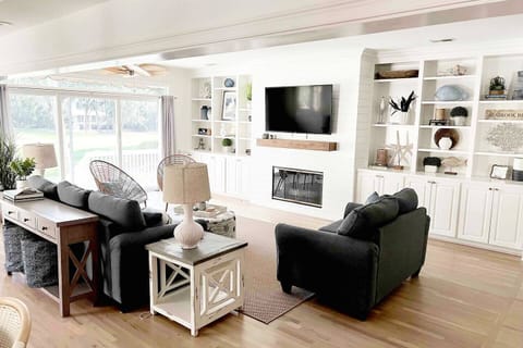 Beautifully decorated coastal home with views of golf course from living room