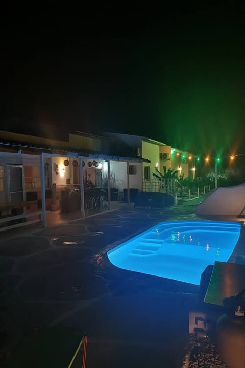 Inviting night-time pool scene with soft lighting