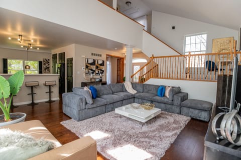 Spacious and inviting, the living room is ready for cozy fall nights, game days, or catching up with friends