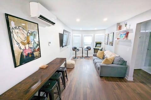 Cozy up in our chic sitting area, featuring a plush sofa perfect for lounging!