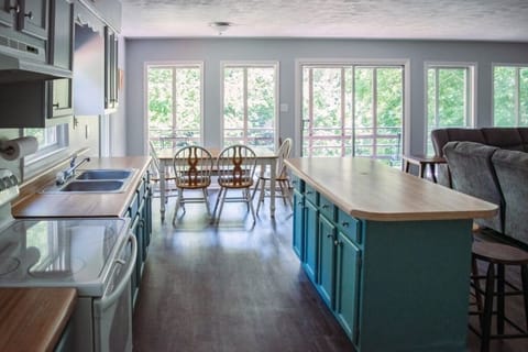 Kitchen/Dining Area with Large Windows Looking Over the Lake