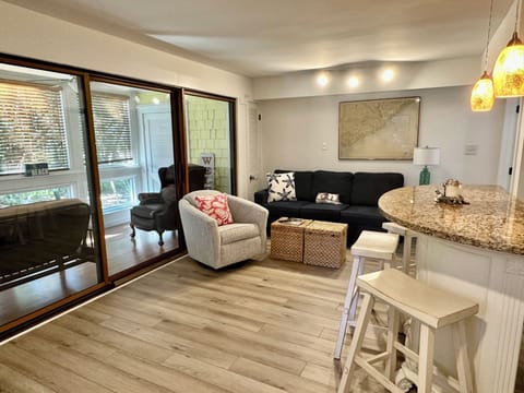Comfortable living room connected to the sunroom.
