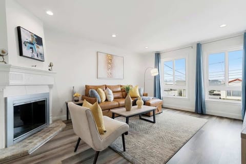 large windows in the living room providing sunlight.
