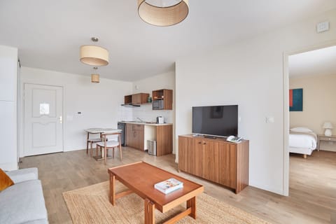 Open-concept layout seamlessly connects kitchen, dining, and living areas for a spacious and functional guest experience.