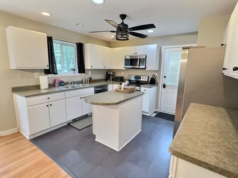 Our kitchen includes: Electric stove, microwave, fridge/freezer and prep space.