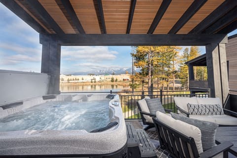 The home's private hot tub overlooks Eagle Lake and offers views of Big Mountain | Exterior