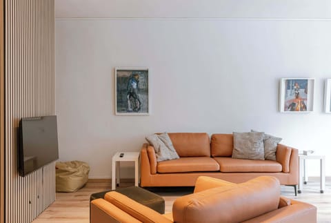 Enjoy a cozy and light-filled living area with modern finishes and a warm ambiance