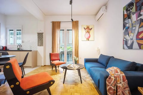 Sunlit living room opening onto the balcony, blending indoor comfort with refreshing outdoor breezes and greenery