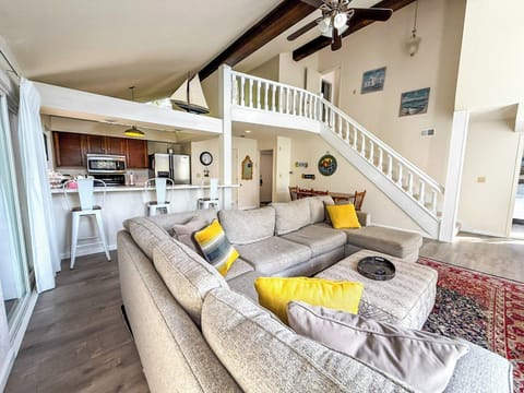 From cozy nights on the couch to morning coffee at the bar, our great room has it all. Your perfect vacation hub!