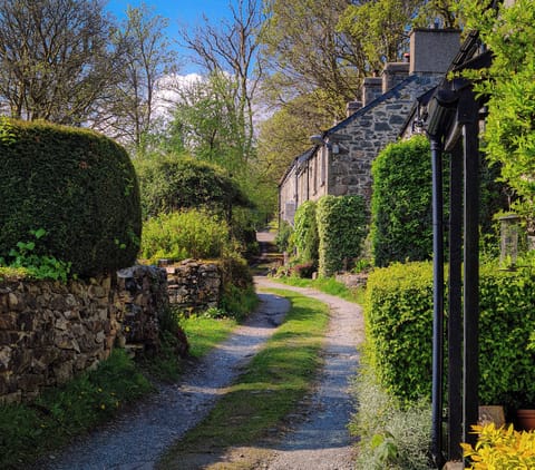Find Little Cott towards the end of the row of cottages along the lane.